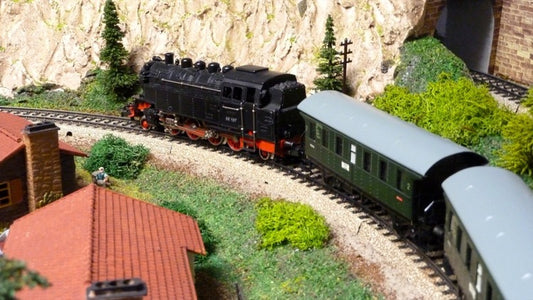 Why Do Some Model Trains Have Three Rails?